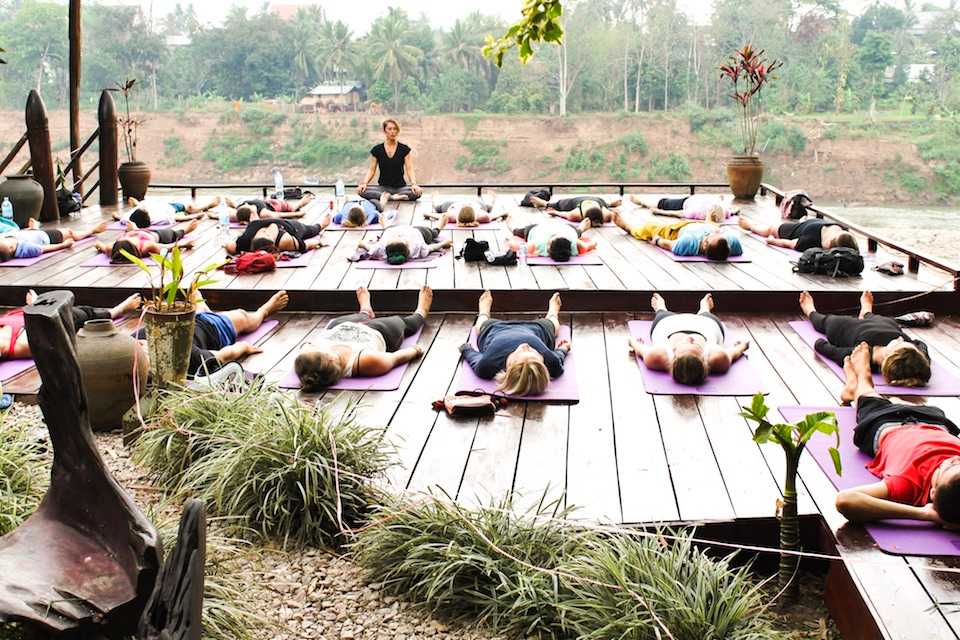 traveling yogini teaching yoga in Laos